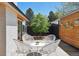 Charming patio featuring stylish seating, a sleek wood fence, and an open-air atmosphere at 2545 S Lowell Blvd, Denver, CO 80219