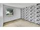 Unique bedroom with quirky wallpaper and a bright window view at 11267 W Colorado Pl, Denver, CO 80232