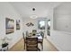 Bright dining area featuring modern decor and seating for six with large windows at 11267 W Colorado Pl, Denver, CO 80232