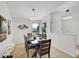 Elegant dining room with modern lighting, a wooden table, and seating for six at 11267 W Colorado Pl, Denver, CO 80232