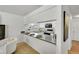 Kitchen featuring white cabinets, and a breakfast bar with place settings at 11267 W Colorado Pl, Denver, CO 80232