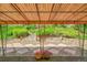 Cozy outdoor patio, lush garden views, stone pavers, and wrought iron accents at 11267 W Colorado Pl, Denver, CO 80232