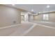 Unfinished basement features carpet, recessed lighting, and a window, providing a blank canvas for customization and future projects at 3422 N Gold Bug Ct, Aurora, CO 80019