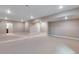 Unfinished basement with carpet, recessed lighting, and ample space for storage or future customization, ready for your creativity at 3422 N Gold Bug Ct, Aurora, CO 80019