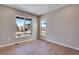 Bedroom with large windows providing lots of natural light and neighborhood views at 3422 N Gold Bug Ct, Aurora, CO 80019