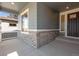 Charming porch features stone accents, and a stylish front door with glass insert panels at 3422 N Gold Bug Ct, Aurora, CO 80019