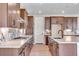 Elegant kitchen with wooden cabinets, granite countertops, stainless steel appliances, and plenty of storage at 3422 N Gold Bug Ct, Aurora, CO 80019