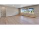 Bright living room with expansive windows offers scenic neighborhood views at 3422 N Gold Bug Ct, Aurora, CO 80019