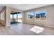 The covered patio has an expansive view of the neighborhood with a sliding glass door at 3422 N Gold Bug Ct, Aurora, CO 80019