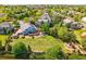 A spacious backyard featuring a well-manicured lawn, a wooden deck, and play equipment at 3715 E 139Th Pl, Thornton, CO 80602