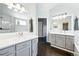 Bathroom with double sink vanity, hardwood floors and a shower at 3715 E 139Th Pl, Thornton, CO 80602