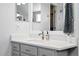 Well-lit bathroom with a stylish vanity, sleek mirror, and modern fixtures at 3715 E 139Th Pl, Thornton, CO 80602