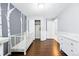 Neutral Bedroom with closet, wood floors, white trim, and charming birch tree wall design at 3715 E 139Th Pl, Thornton, CO 80602