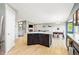 Open kitchen view features the kitchen island and an open floor plan at 3715 E 139Th Pl, Thornton, CO 80602