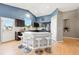Spacious kitchen featuring an island with seating, dark cabinets, and stainless steel appliances at 3715 E 139Th Pl, Thornton, CO 80602