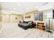 Spacious living room with a cozy gray sectional sofa and lots of natural light at 3715 E 139Th Pl, Thornton, CO 80602