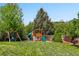 Backyard with swing set and slide at 3715 E 139Th Pl, Thornton, CO 80602