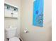 Toilet, toilet paper, and decor in a water closet at 94 Vale St, Palmer Lake, CO 80133