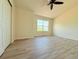Bedroom with a large window offering a view; the floors are a nice, neutral hardwood at 94 Vale St, Palmer Lake, CO 80133