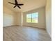Bedroom with a large window offering a view; the floors are a nice, neutral hardwood at 94 Vale St, Palmer Lake, CO 80133