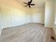 Spacious bedroom featuring a ceiling fan, closet, and neutral walls and floors at 94 Vale St, Palmer Lake, CO 80133