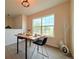 Bright dining area featuring table setting for two, a large window with natural light and decor at 94 Vale St, Palmer Lake, CO 80133