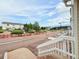 Scenic view of a community street with manicured lawns and common area at 94 Vale St, Palmer Lake, CO 80133
