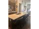 Modern kitchen island with bar seating and stainless steel sink at 11621 Colony Loop Loop, Parker, CO 80138