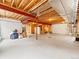 Unfinished basement space ready for customization with exposed beams and a concrete floor at 11621 Colony Loop, Parker, CO 80138