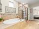 A luxurious bathroom featuring a standalone tub and a separate glass shower at 11621 Colony Loop, Parker, CO 80138