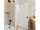 Bathroom with a shower, a tub, neutral-colored tiles, and a modern design at 11621 Colony Loop, Parker, CO 80138