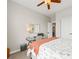Comfortable bedroom featuring a ceiling fan, a vanity, and ample closet space at 11621 Colony Loop, Parker, CO 80138