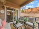 Cozy covered patio with outdoor seating, perfect for relaxing and entertaining at 11621 Colony Loop, Parker, CO 80138