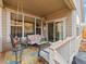 Inviting covered patio featuring comfortable seating and a swing for relaxation at 11621 Colony Loop, Parker, CO 80138