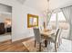 Bright dining room featuring a chandelier, large mirror, and windows offering natural light and inviting ambiance at 11621 Colony Loop, Parker, CO 80138