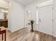 Bright entryway with stylish flooring, a white front door, and views into other rooms at 11621 Colony Loop, Parker, CO 80138