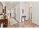Inviting entryway with wood floors, white trim, and an open floor plan at 11621 Colony Loop, Parker, CO 80138