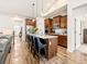 Modern kitchen with an island, stainless steel appliances, and open layout, perfect for entertaining and Gathering gatherings at 11621 Colony Loop, Parker, CO 80138