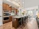 Beautiful kitchen with a large island, pendant lighting, and a view into the dining area at 11621 Colony Loop, Parker, CO 80138
