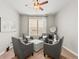Living room with gray chairs, a patterned ottoman, and natural light at 11621 Colony Loop, Parker, CO 80138