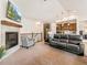 Cozy living room featuring a fireplace, TV, and open layout, ideal for gatherings and comfortable everyday living at 11621 Colony Loop, Parker, CO 80138