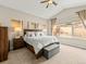 Inviting main bedroom with a large window, allowing natural light, a comfortable bed, and a serene atmosphere at 11621 Colony Loop, Parker, CO 80138