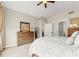 Bright main bedroom with a dresser, carpeted floors, and neutral tones, creating a relaxing and inviting atmosphere at 11621 Colony Loop, Parker, CO 80138