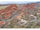 Estate home nestled among rock formations with nearby modern home on expansive lot at 5688 Red Fern Ct, Littleton, CO 80125