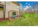 Backyard featuring a garden bed enclosure and spacious lawn perfect for outdoor enjoyment at 5688 Red Fern Ct, Littleton, CO 80125