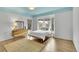 Cozy bedroom with large windows providing scenic outdoor views at 5688 Red Fern Ct, Littleton, CO 80125