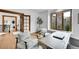 Inviting home office with natural light, hardwood floors, and cozy seating area for focused work at 5688 Red Fern Ct, Littleton, CO 80125