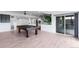 Spacious finished basement features a pool table, a walkout to the backyard, and plenty of room to relax at 16262 W 95Th Ln, Arvada, CO 80007
