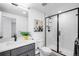 Contemporary bathroom with sleek glass shower, modern vanity, and stylish decor at 16262 W 95Th Ln, Arvada, CO 80007