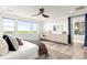 Bright bedroom boasting scenic views, a vanity, and a walk-in closet leading to the bathroom at 16262 W 95Th Ln, Arvada, CO 80007